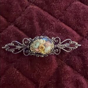 This is a vintage Victorian-style brooch pin.